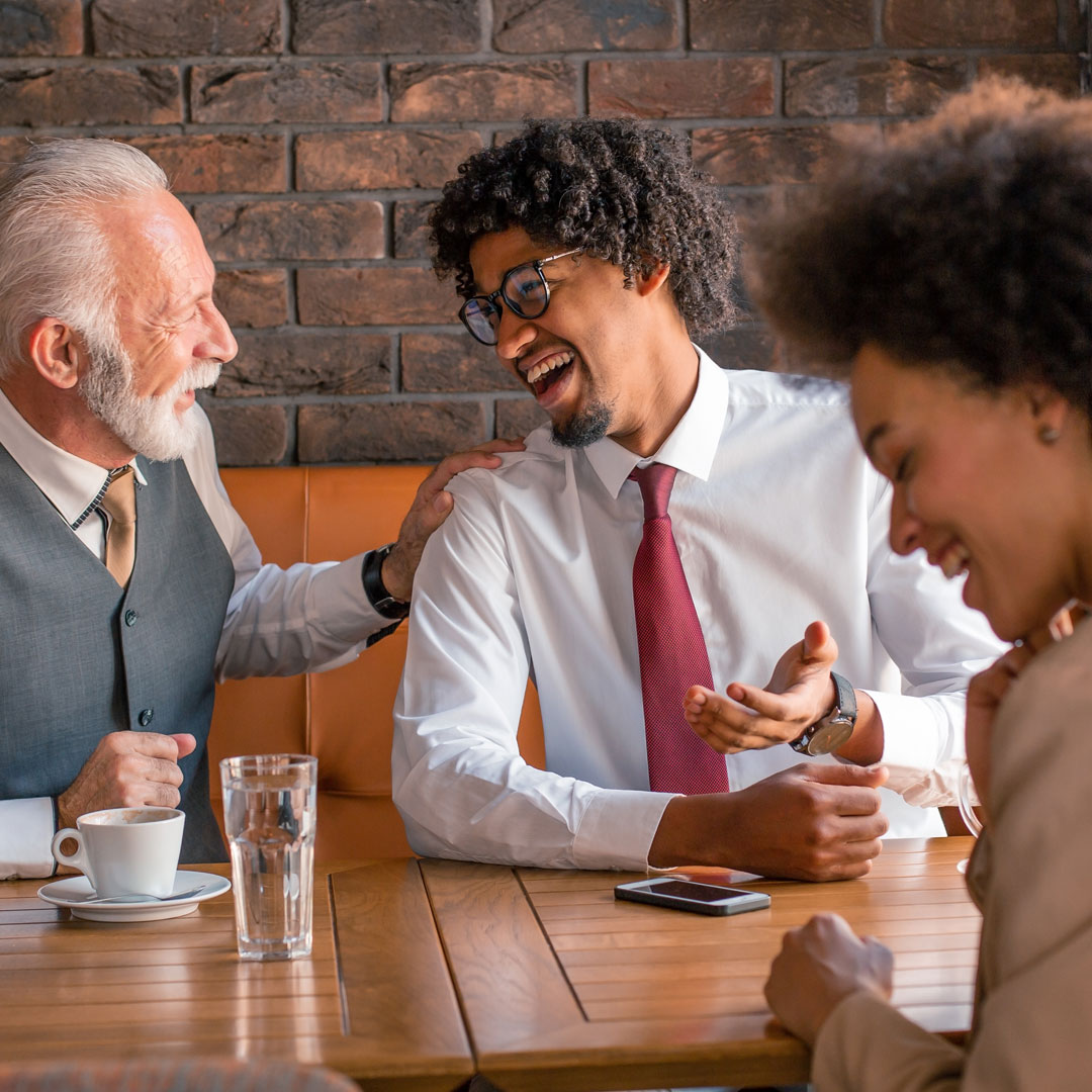 People shaking hands during a business meeting.