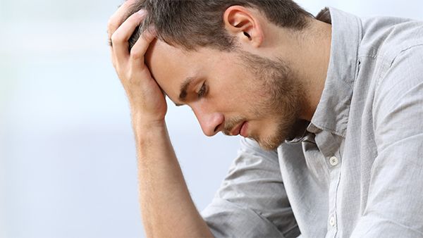 Man holding his head