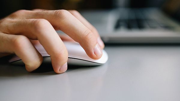 Hand on a computer mouse