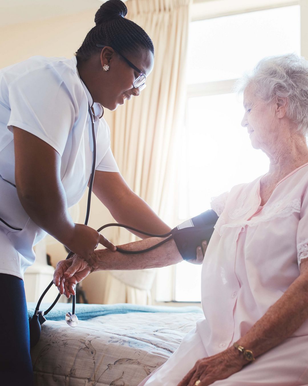 Elderly woman getting her blood pressure taken