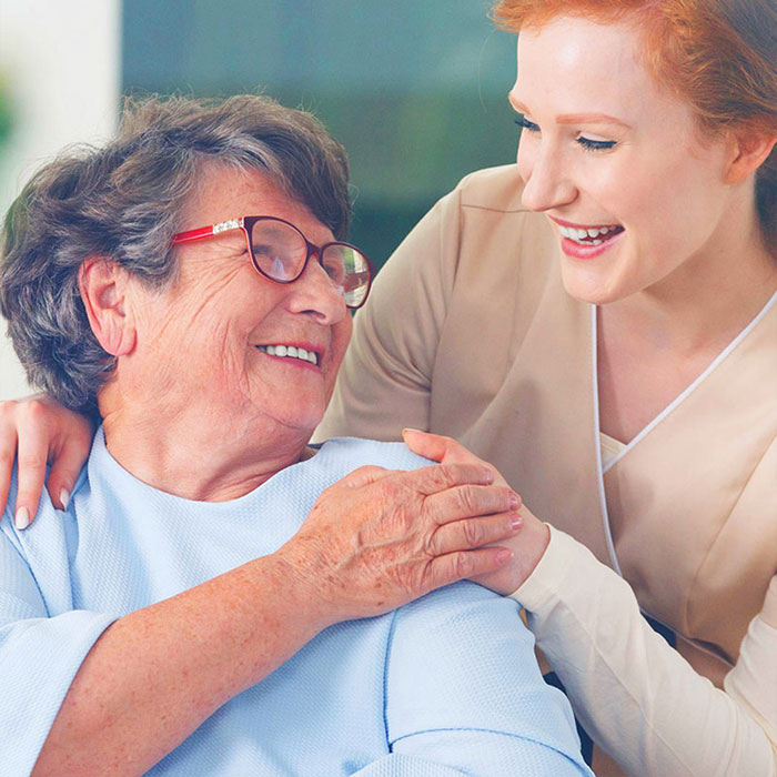 A hospice nurse taking care of an elderly patient