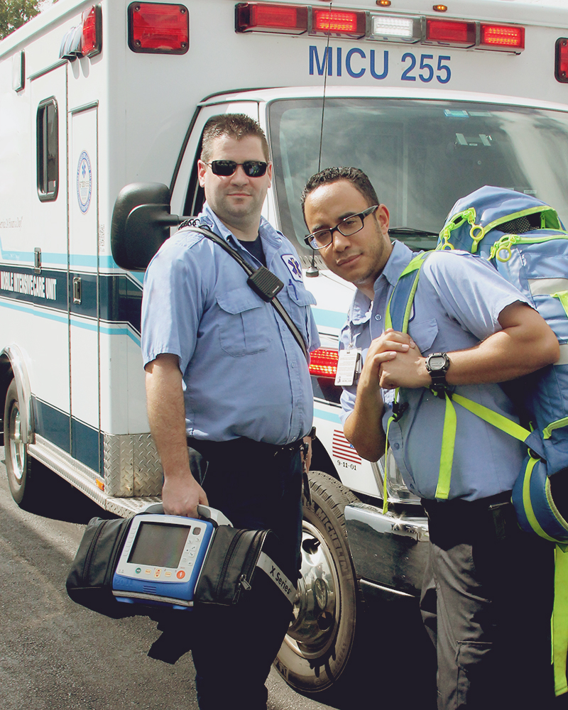 Two EMTs outside ambulance