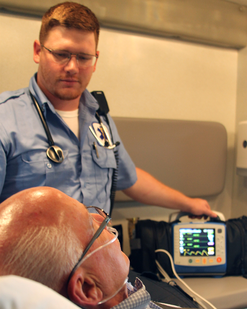 EMT with patient in ambulance