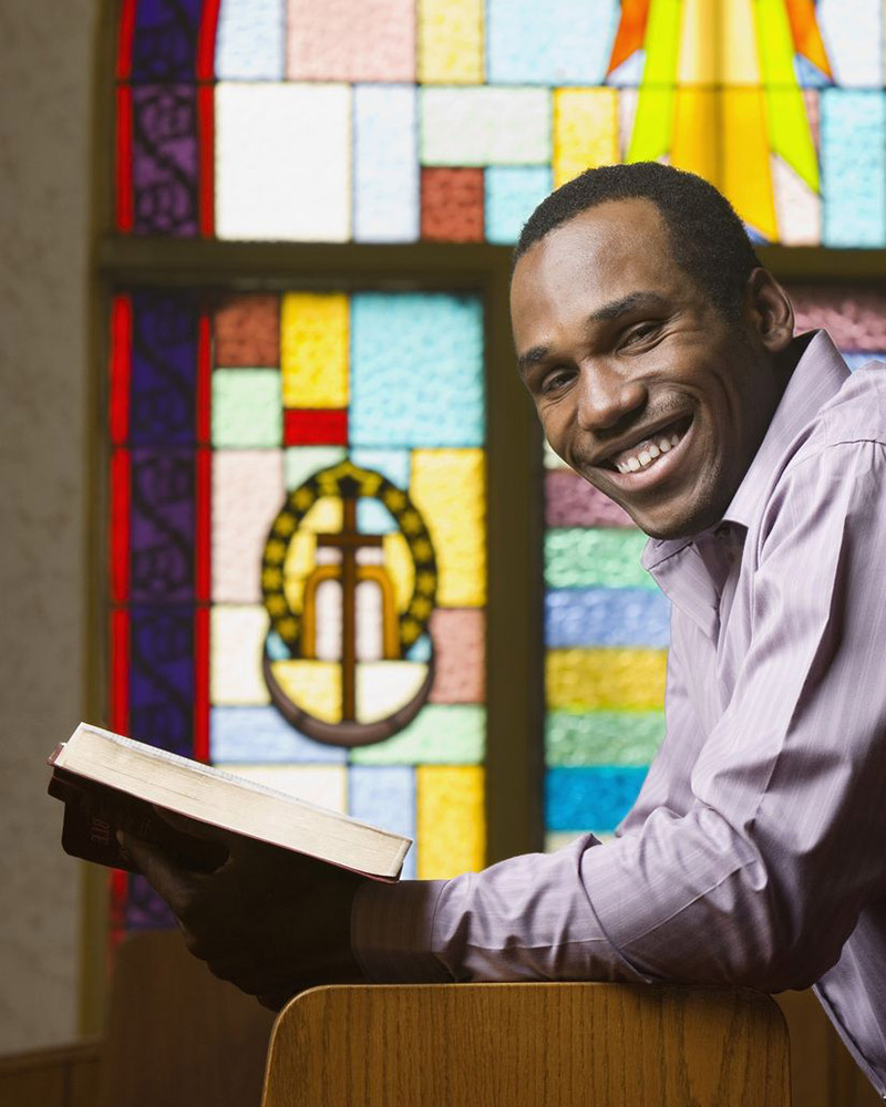 Man in church reading his bible