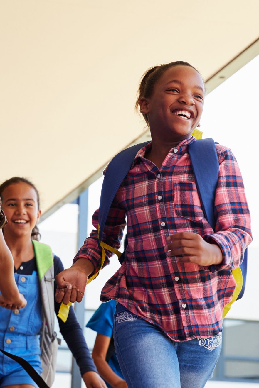 Children laughing on a school bus