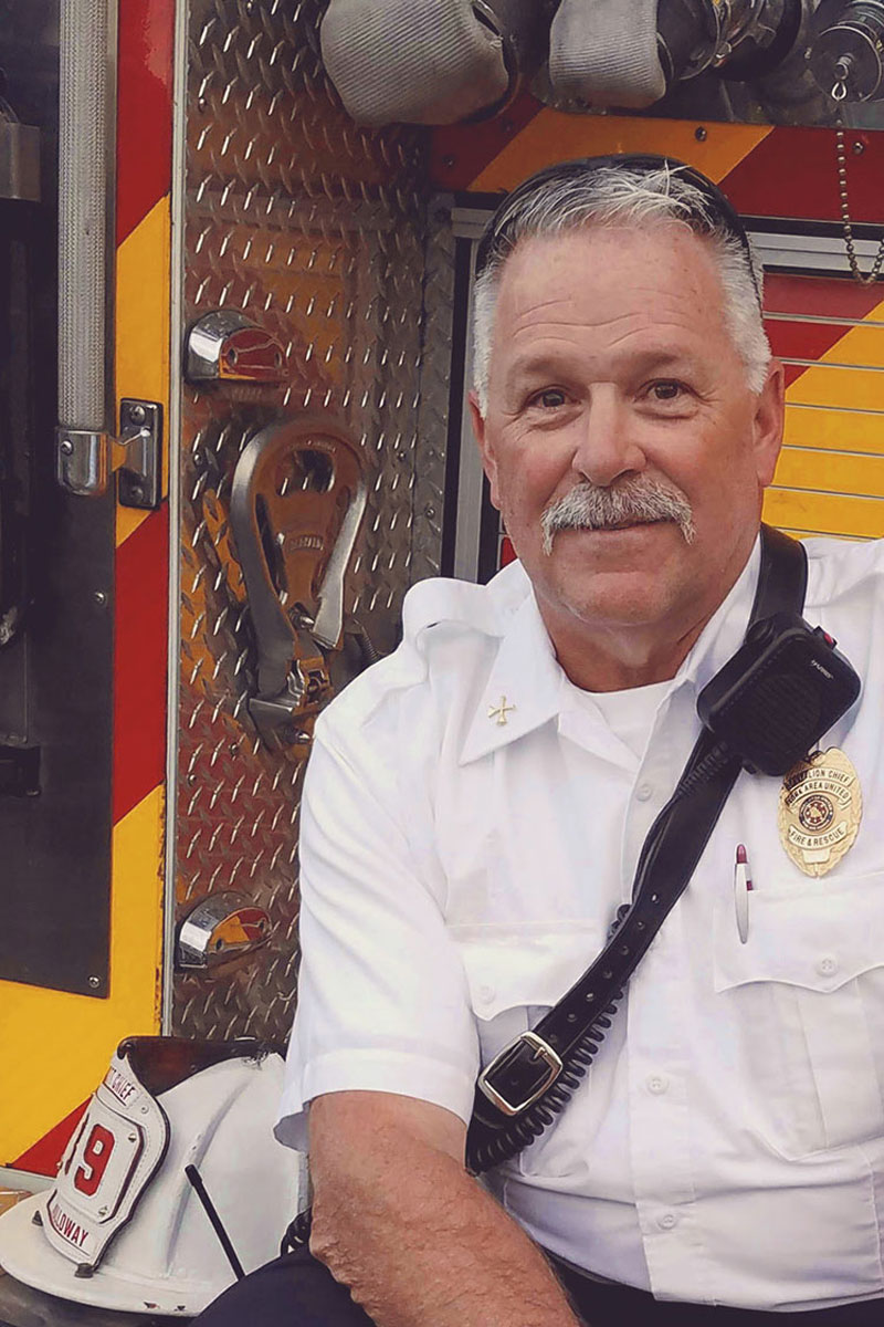 Uniformed Fire Chief smiling