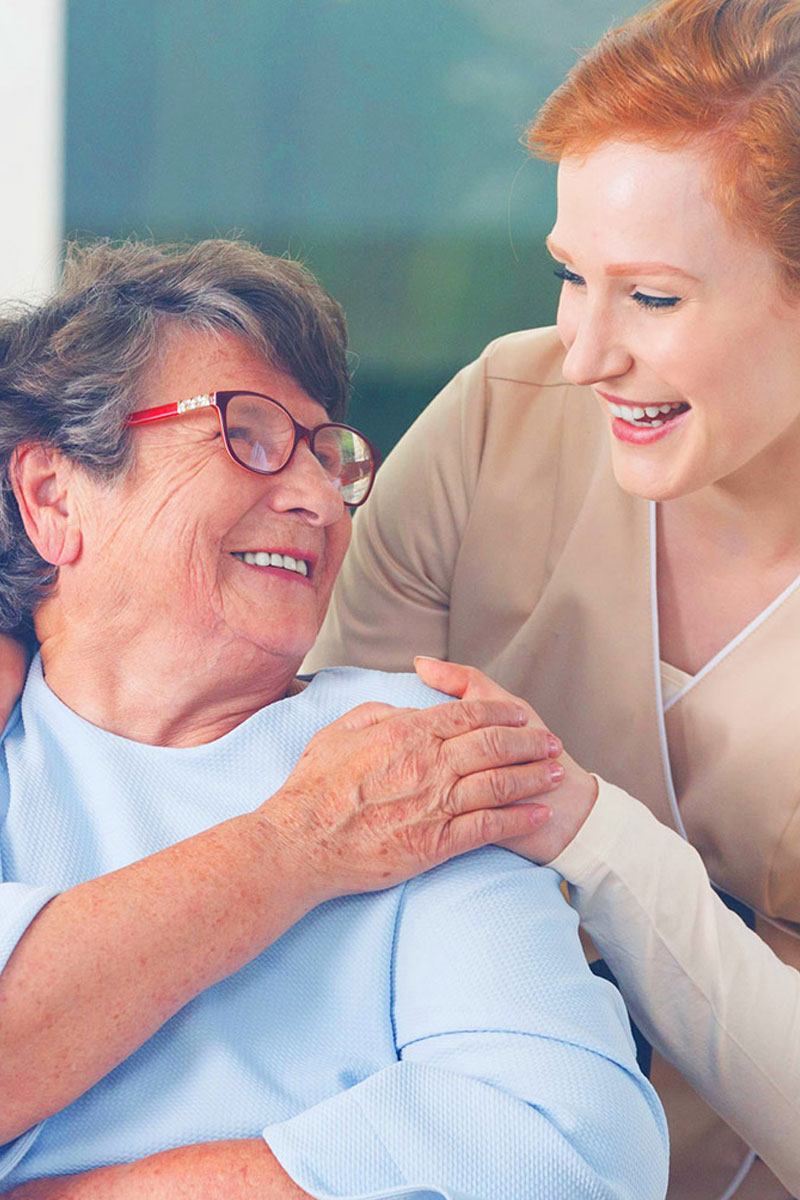 Nurse caring for an elderly woman