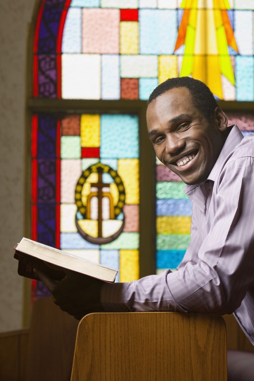 A pastor smiling at the pulpit