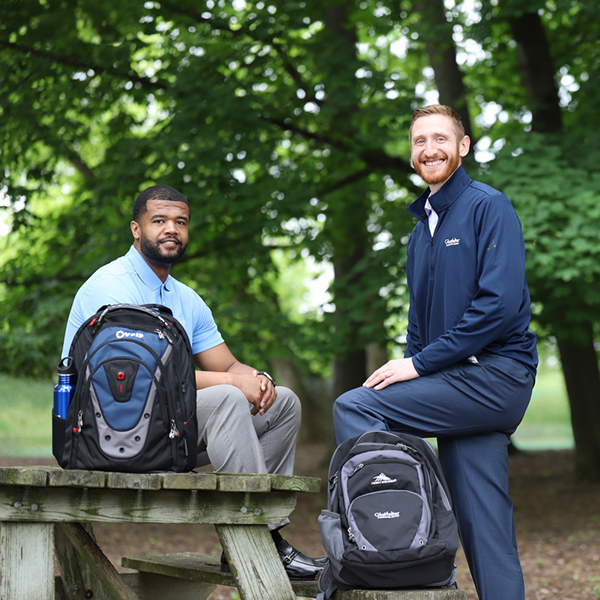 Associates wearing and displaying promo store items